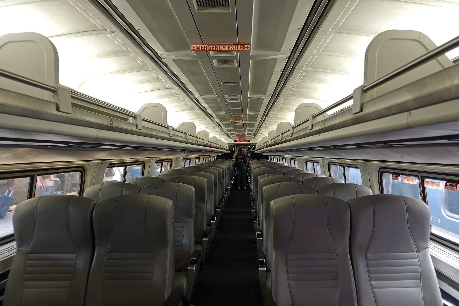 Rows of seats inside an Amtrak coach car