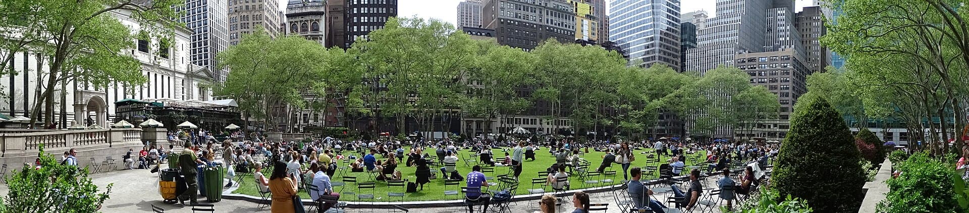 Bryant Park lawn surrounded by Midtown Manhattan buildings