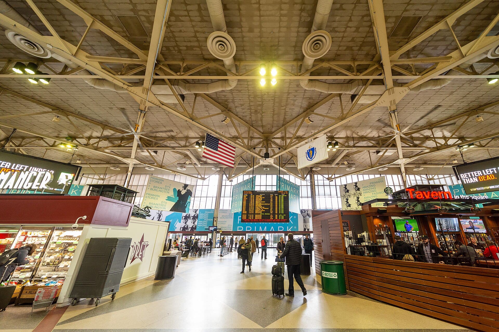 Passenger concourse and departure boards inside Boston South Station